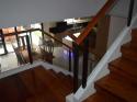 Glass Modern Stair Railing in Wrought Iron Frame